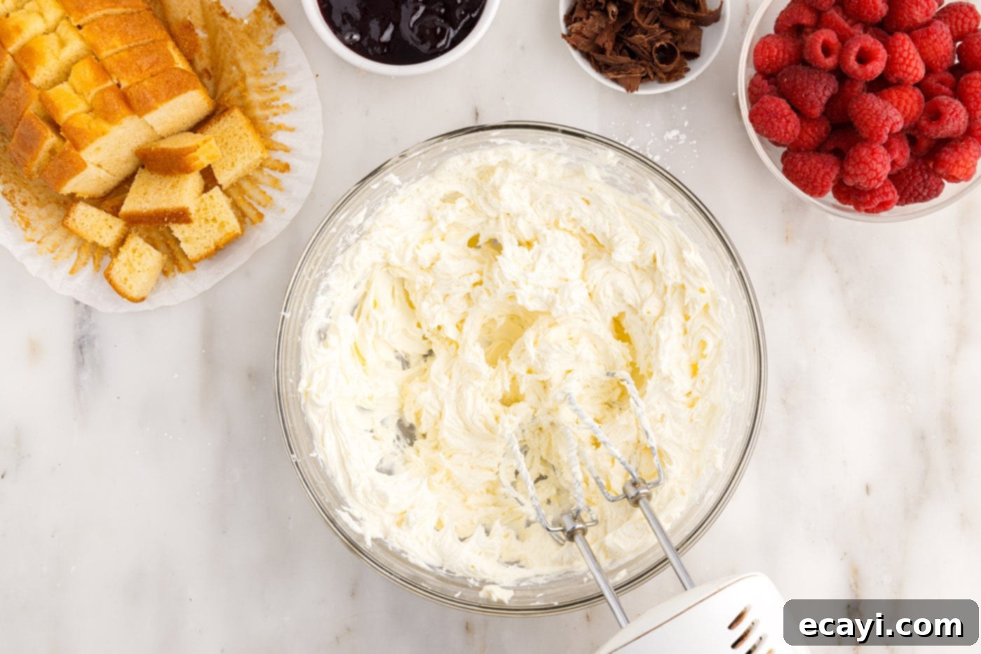 Raspberry Trifle 6 smooth and fluffy cream cheese mixture in a bowl with a mixer