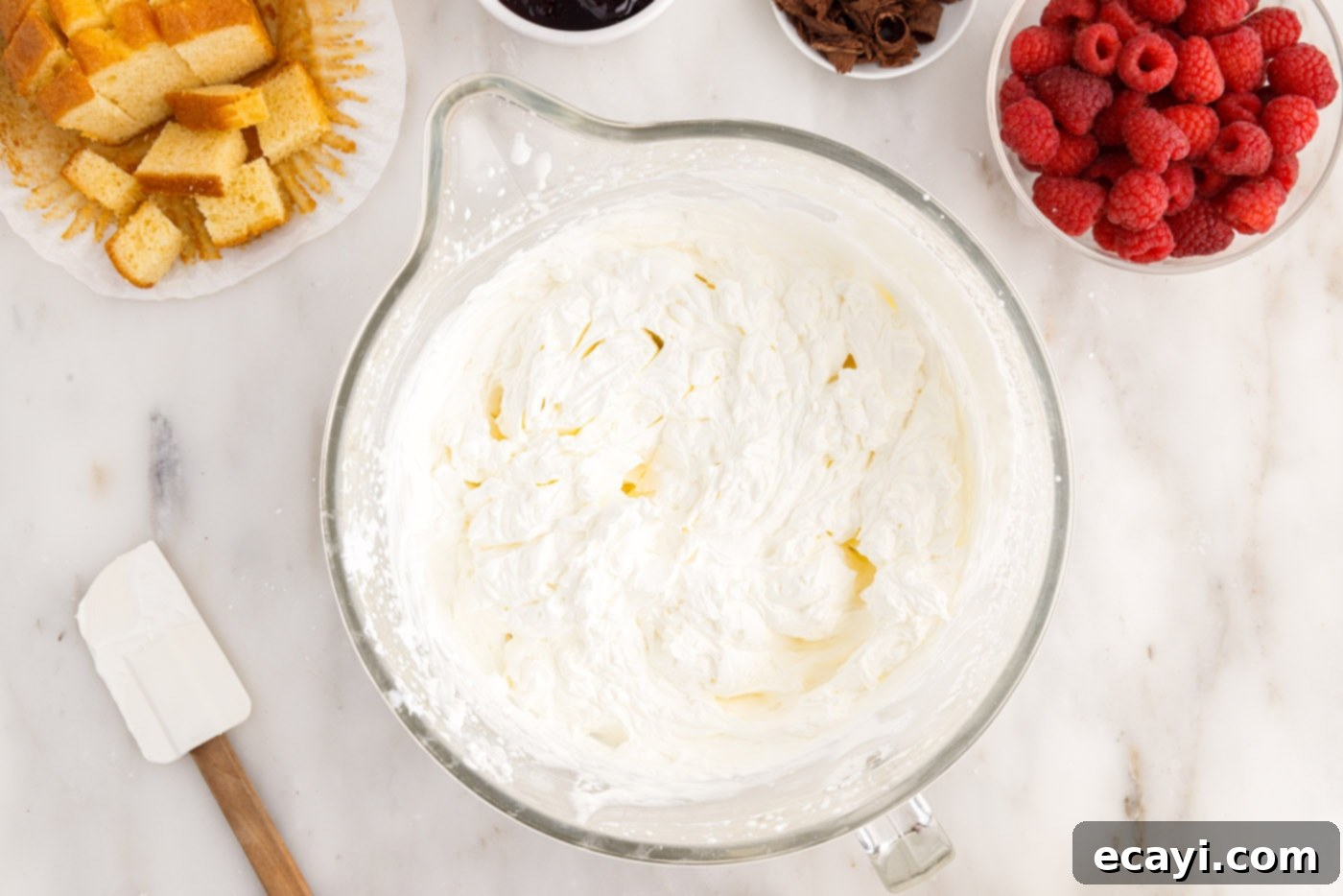 Raspberry Trifle 8 perfectly whipped cream with stiff peaks in a bowl