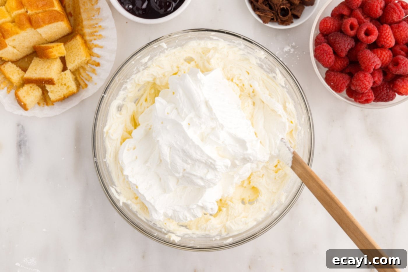 Raspberry Trifle 9 folding whipped cream into the cream cheese mixture until just combined