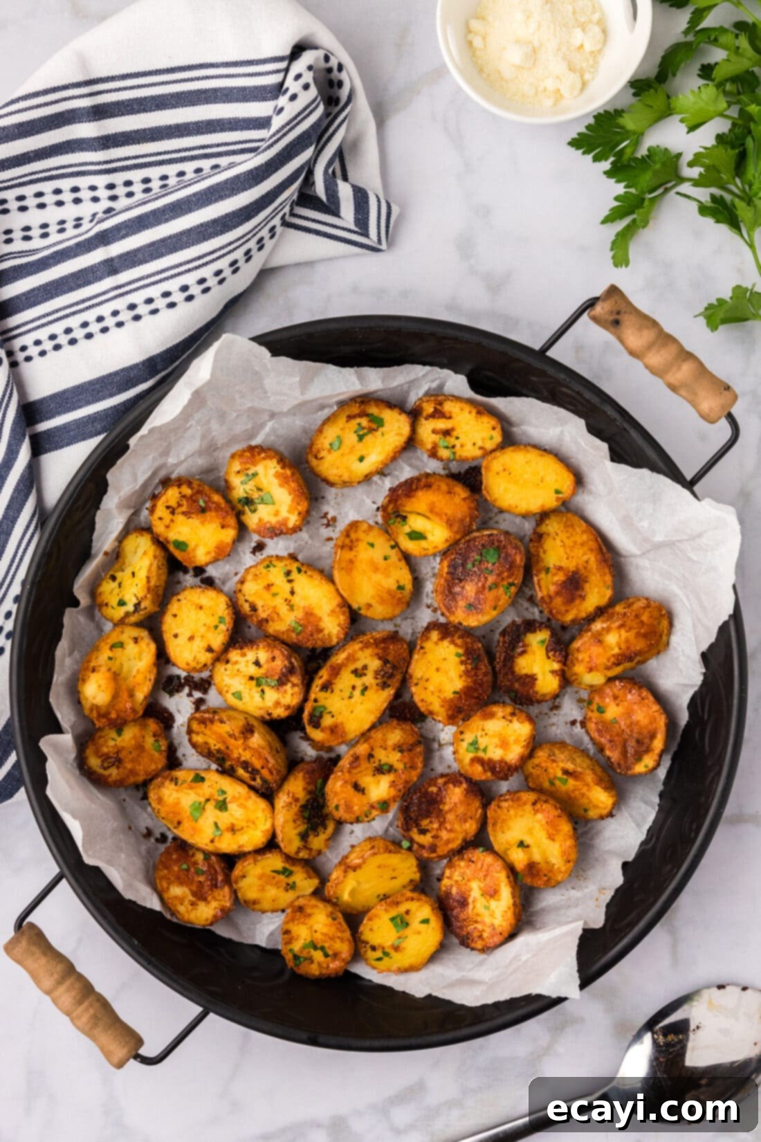 Crispy Parmesan Potatoes 2 Platter of Crispy Roasted Parmesan Potatoes, perfectly golden and ready to serve