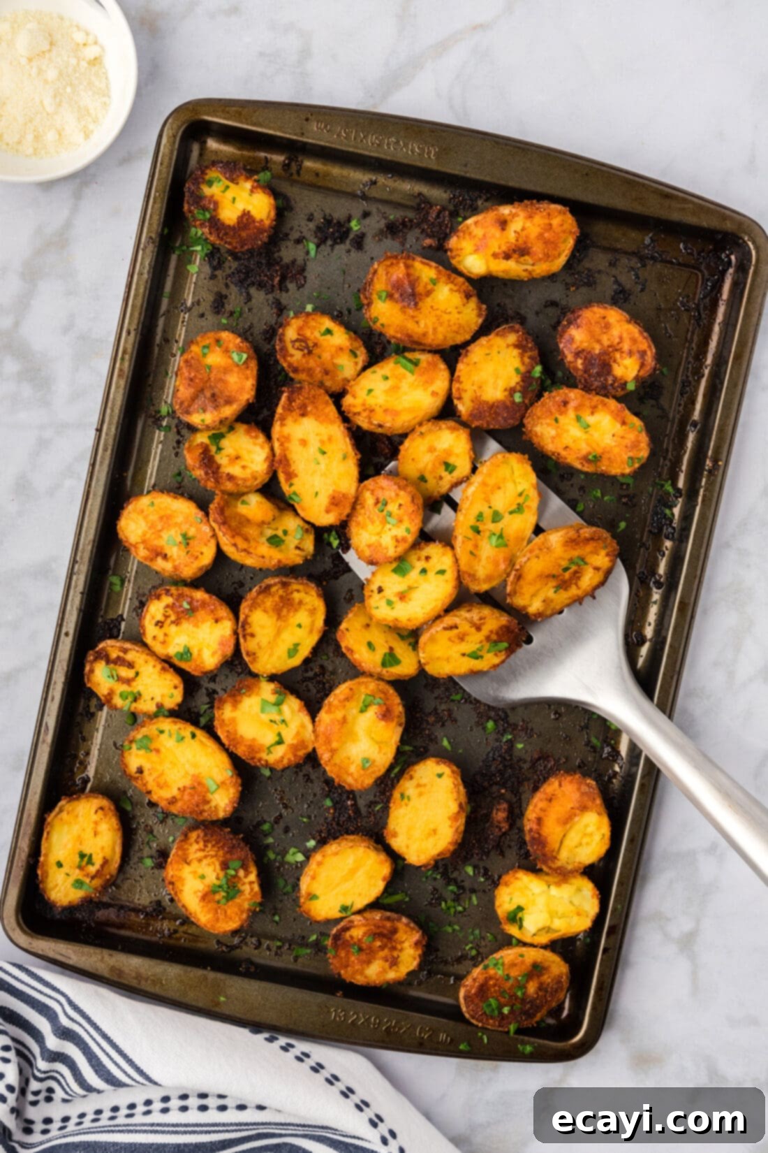 Crispy Parmesan Potatoes 15 Large sheet pan full of golden crispy parmesan potatoes, freshly roasted