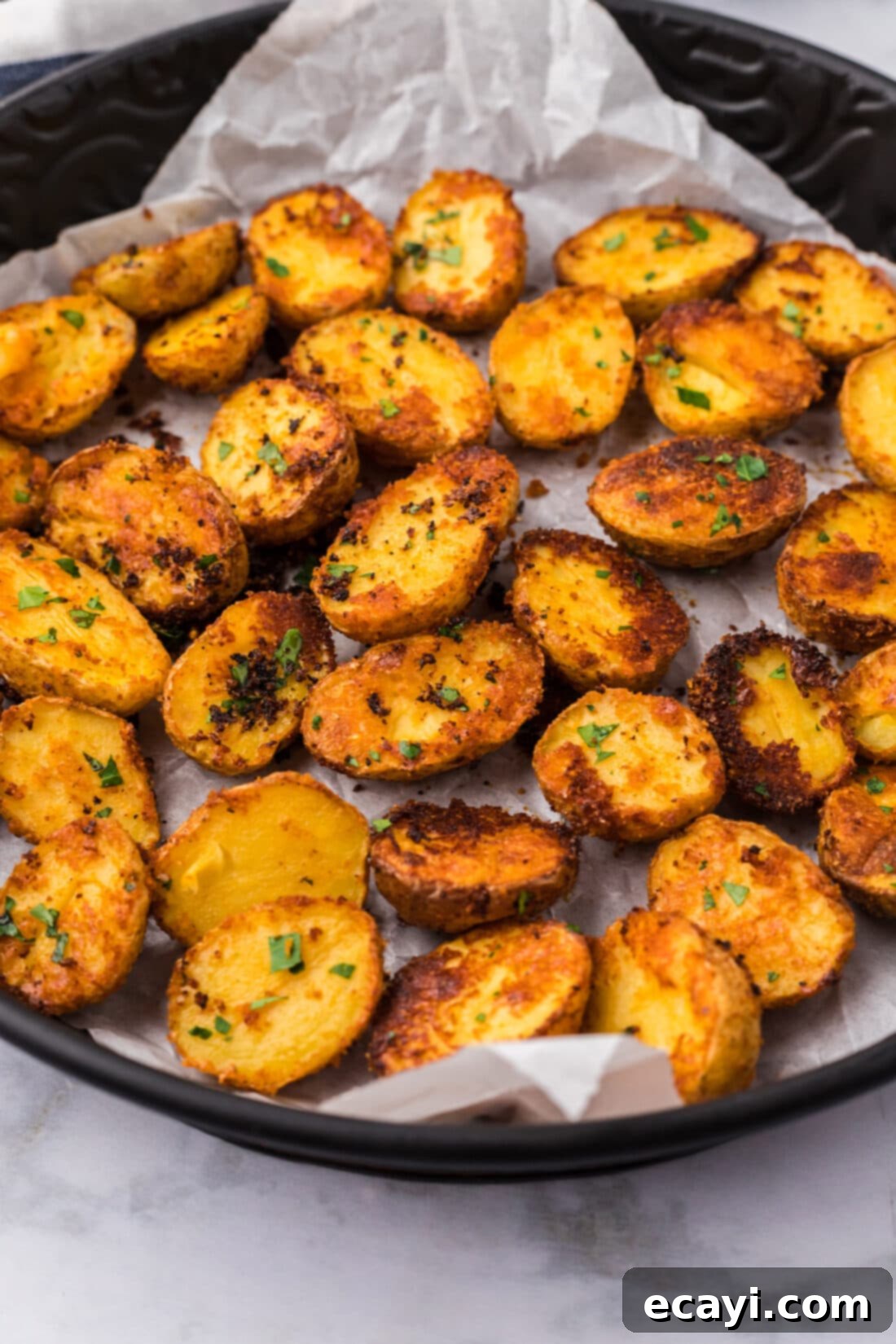 Crispy Parmesan Potatoes 3 Close up photo of individual Parmesan Potatoes with visible crispy edges and seasoning