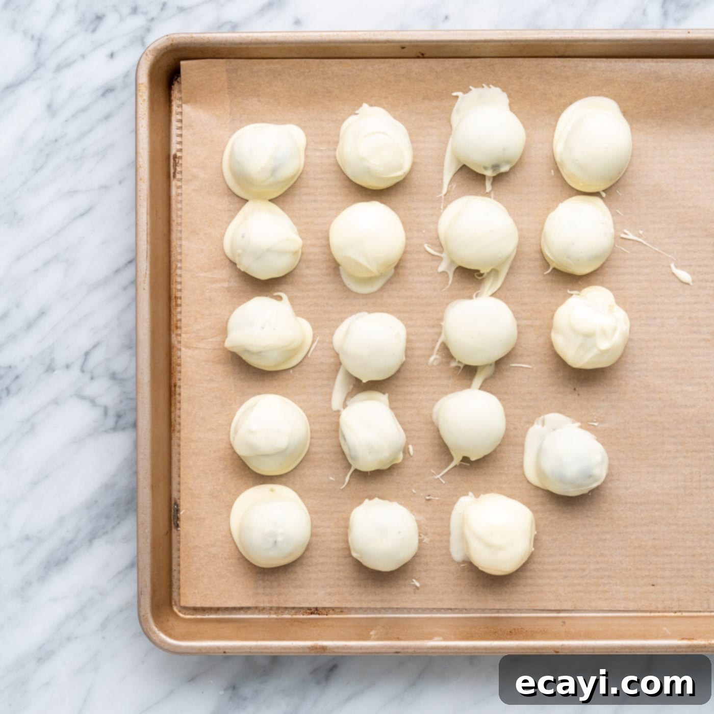 Stars and Stripes Oreo Truffles 13 White chocolate coated oreo truffles drying on a baking sheet