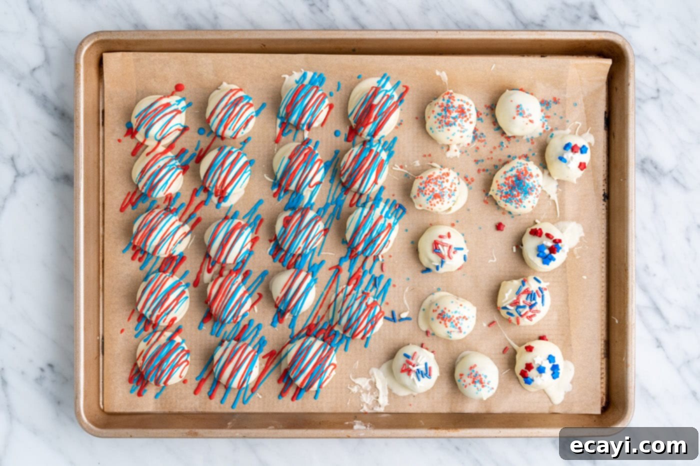 Stars and Stripes Oreo Truffles 17 Patriotic decorated oreo truffles displayed on a baking sheet, ready for serving