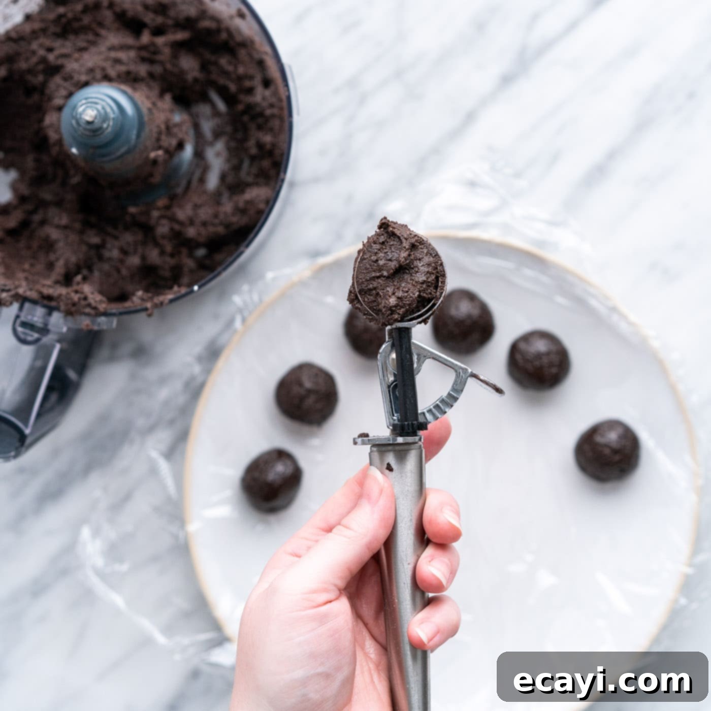 Stars and Stripes Oreo Truffles 8 Scooping out portions of oreo truffle mixture