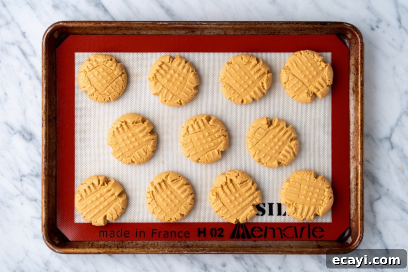 Peanut Butter Cake Mix Delights 15 Freshly baked cake mix peanut butter cookies on a baking sheet, golden and slightly puffed.