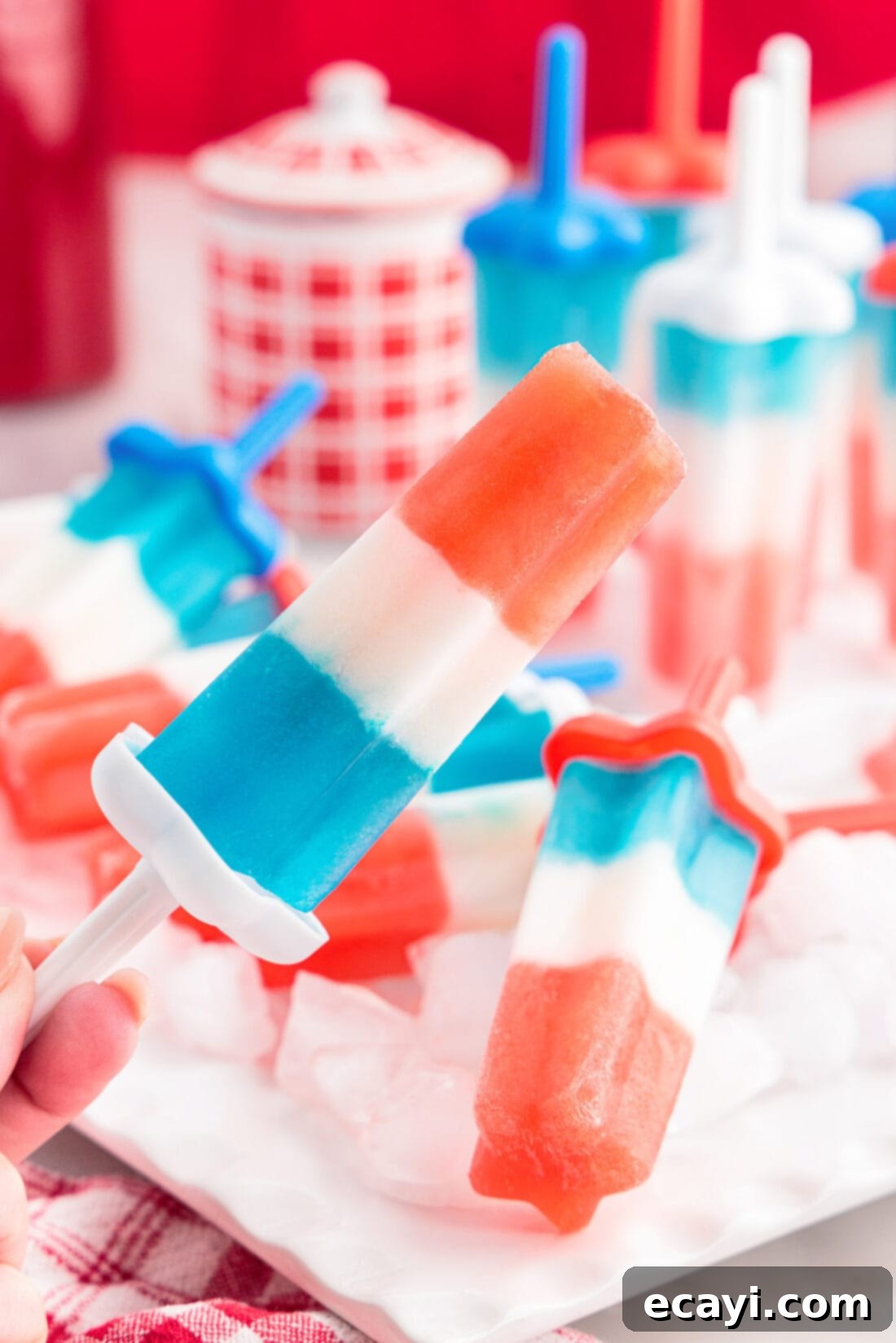 Stars & Stripes Freeze Pops 2 Vibrant red, white, and blue homemade patriotic bomb pops ready to enjoy on a sunny day.