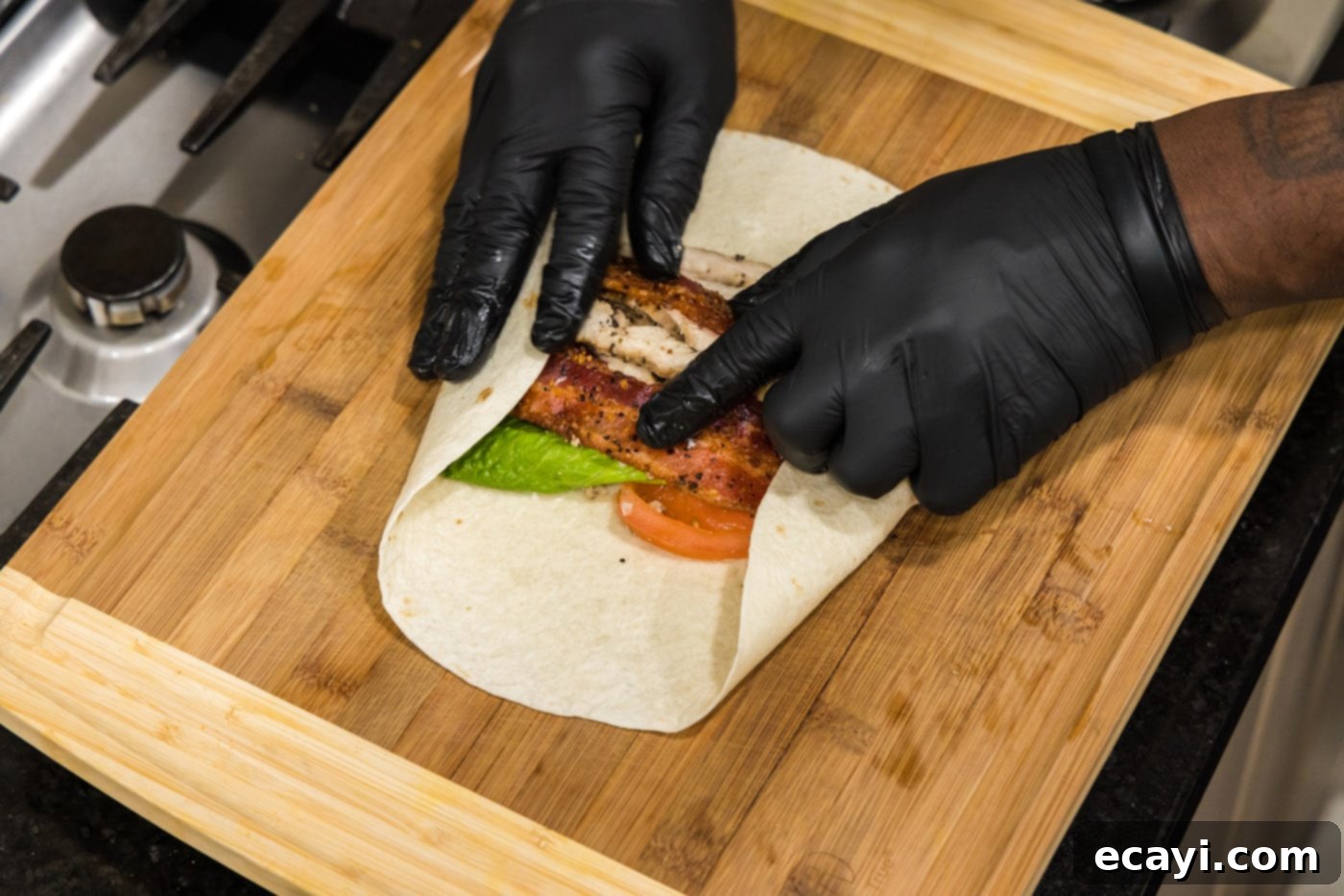 Signature Chicken Bacon Ranch Wrap 11 hands rolling chicken bacon ranch wrap
