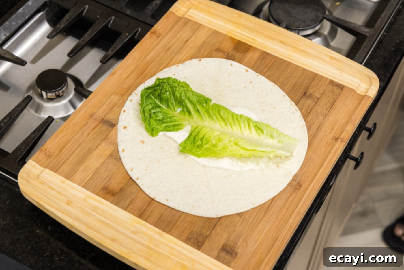 Signature Chicken Bacon Ranch Wrap 6 lettuce leaf on top of ranch dressing and tortilla