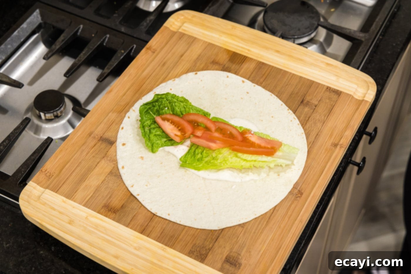 Signature Chicken Bacon Ranch Wrap 7 sliced tomato added on top of lettuce and ranch