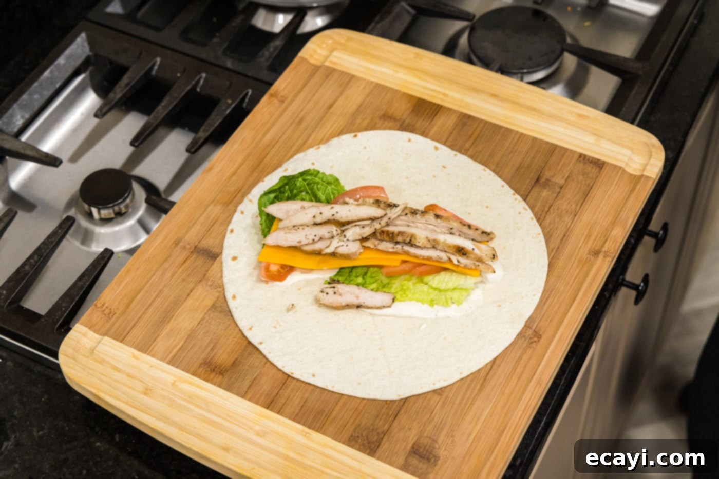 Signature Chicken Bacon Ranch Wrap 9 sliced chicken on top of lettuce, ranch, tomato, and cheese wrap