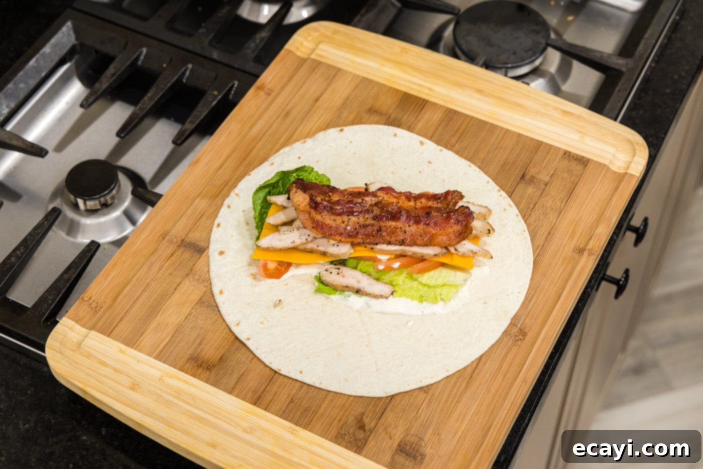 Signature Chicken Bacon Ranch Wrap 10 chicken bacon ranch wrap on a cutting board