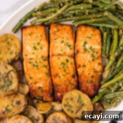 Caramelized Salmon 11 Close up photo of Brown Sugar Salmon served on a platter with garlic green beans and melting potatoes