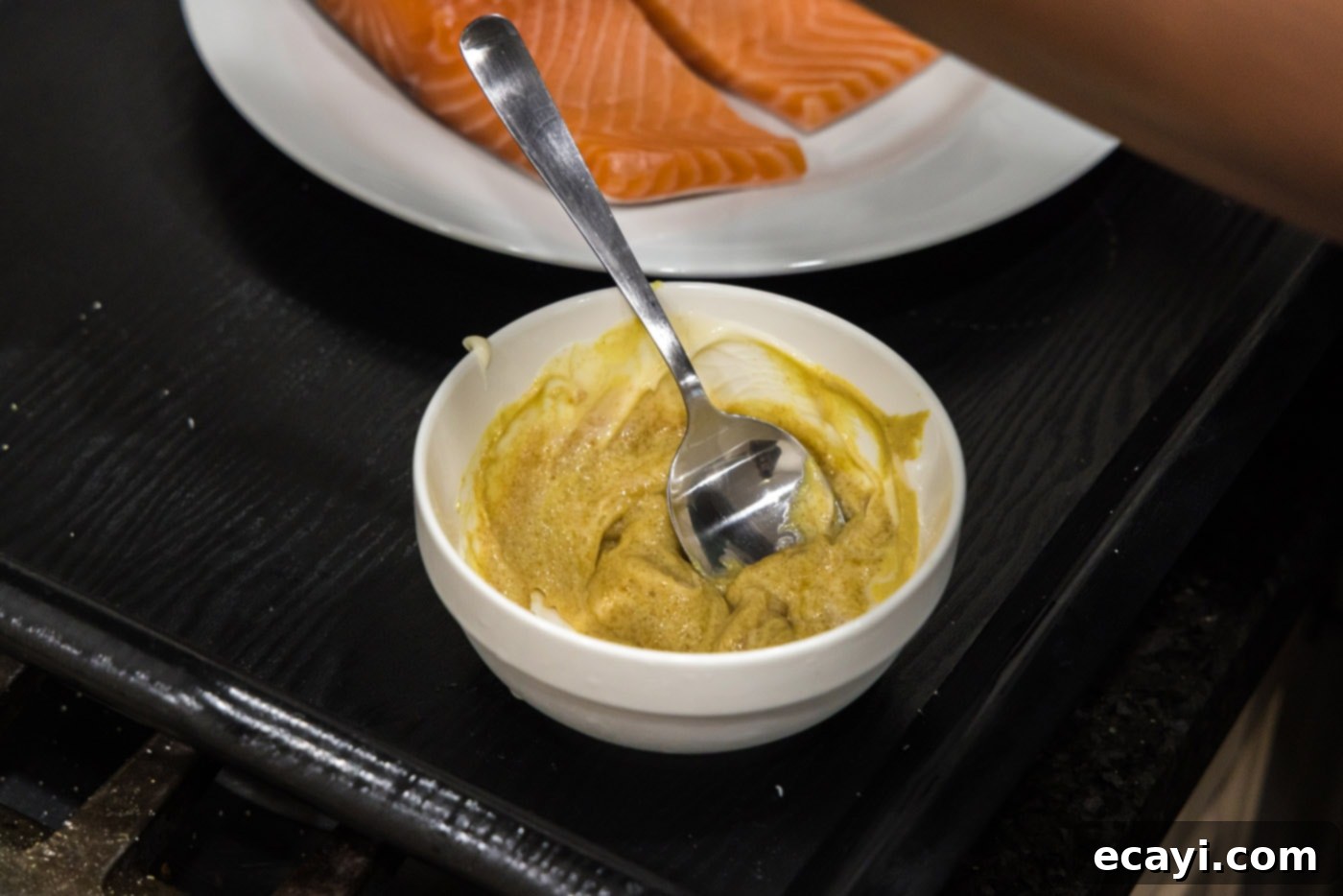 Caramelized Salmon 5 Close-up of Dijon mustard, brown sugar, and softened butter mixed together in a small bowl.