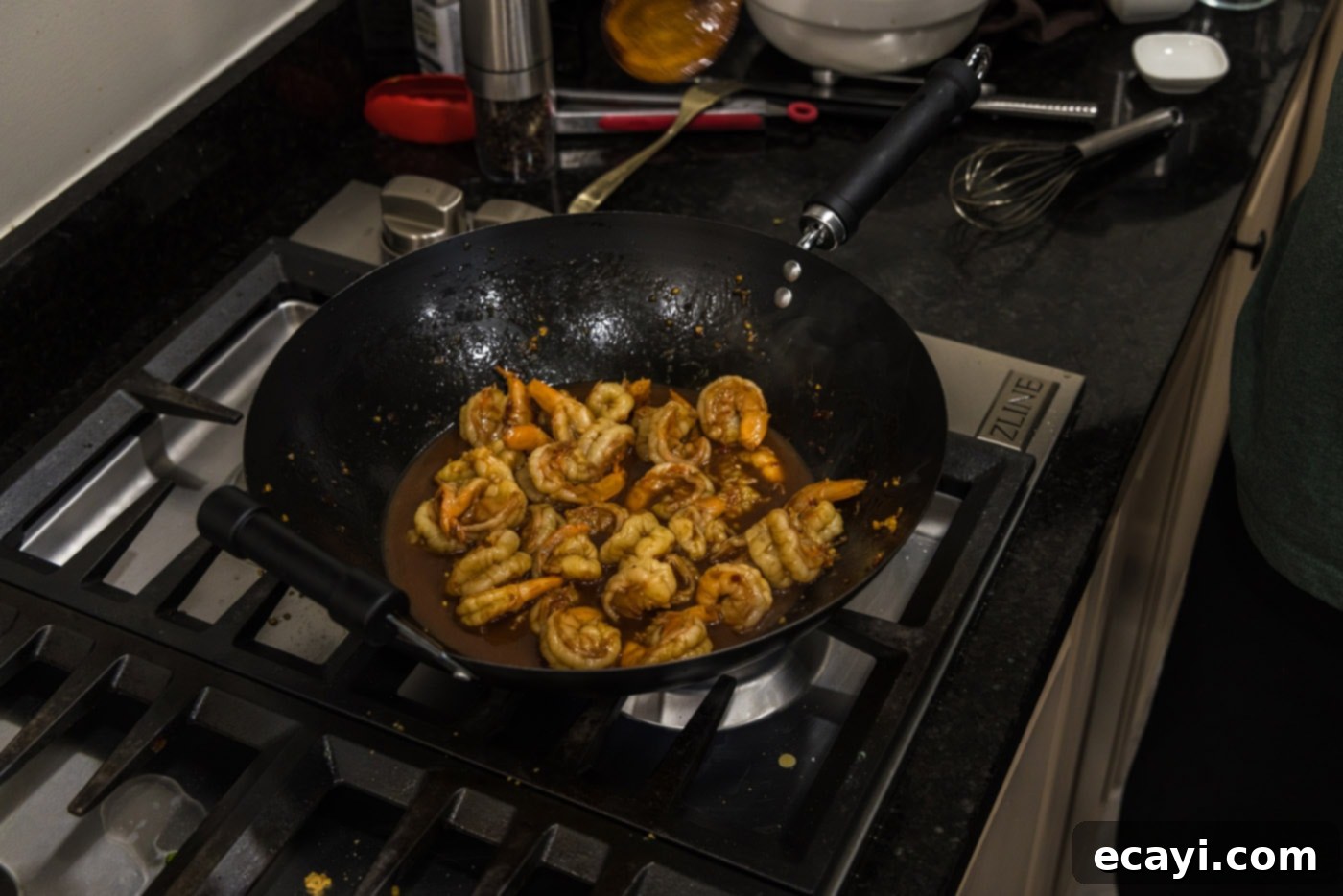 Fiery Hunan Shrimp 9 Hunan shrimp simmering in a wok, with the sauce thickening to a perfect consistency, ready to be served