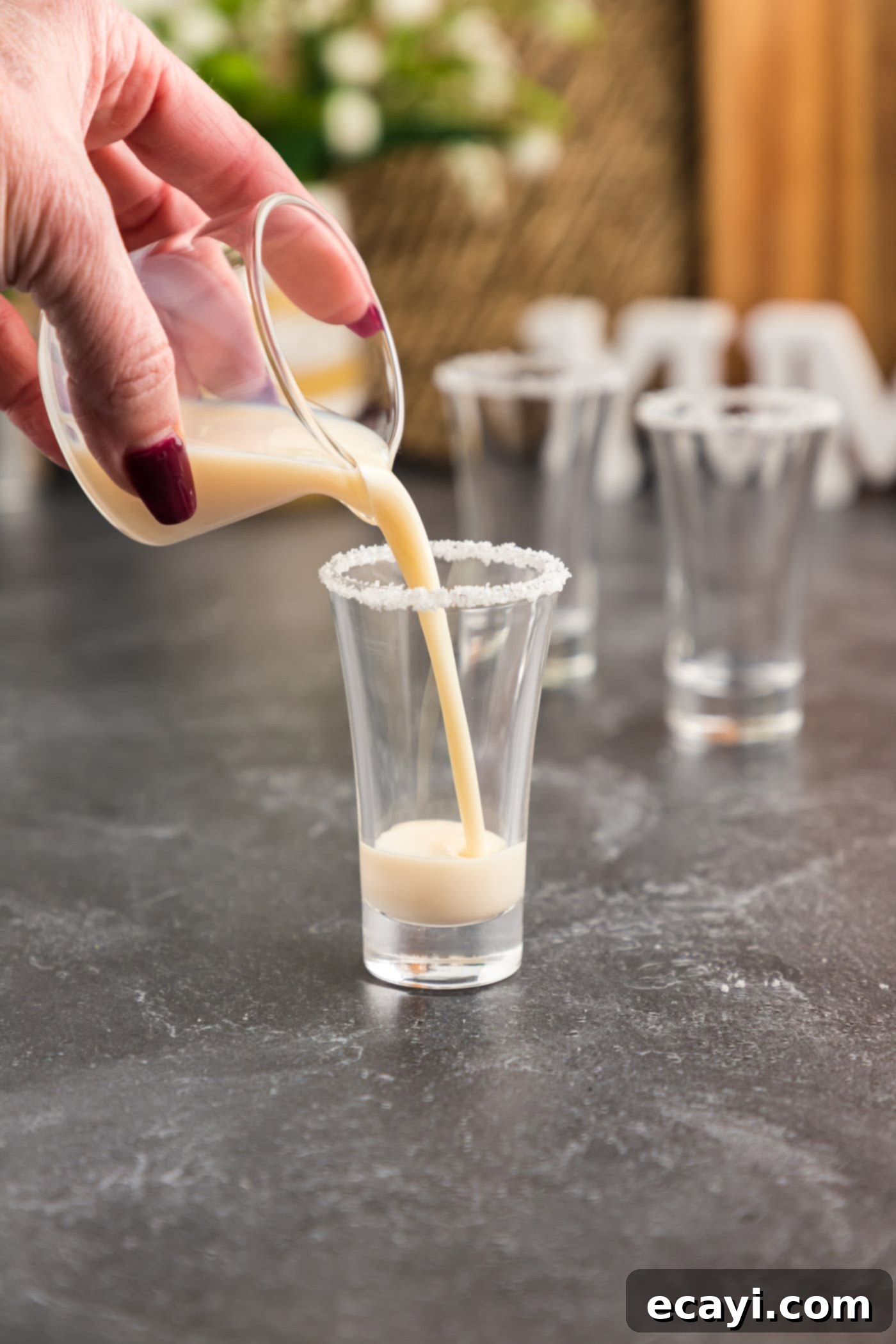 Salted Caramel Nut Blast 7 Pouring RumChata into a prepared shot glass