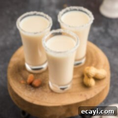 Salted Caramel Nut Blast 10 Three Salted Nut Roll Shots on a wooden tray, ready for a party