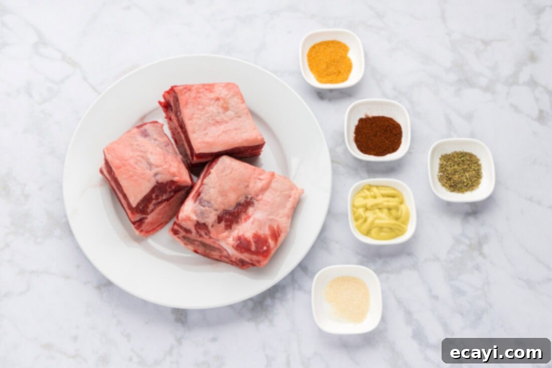 Melt in Your Mouth Smoked Short Ribs 4 Ingredients for Smoked Beef Short Ribs laid out on a cutting board