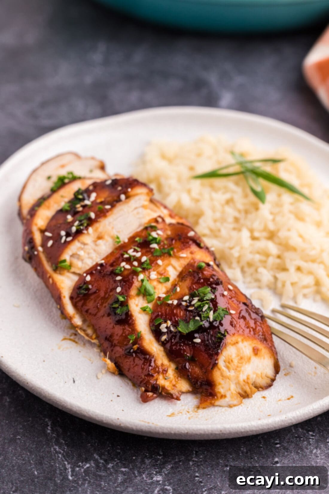 Sticky Honey Garlic Chicken 13 Sliced Honey Garlic Chicken Breast on a plate with rice