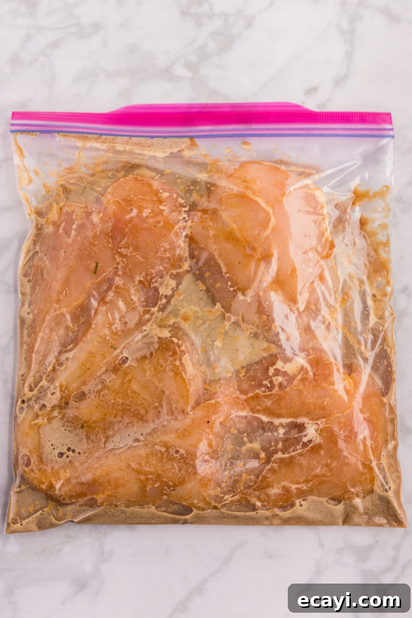 Sticky Honey Garlic Chicken 6 marinating chicken breasts in soy-garlic-and honey sauce