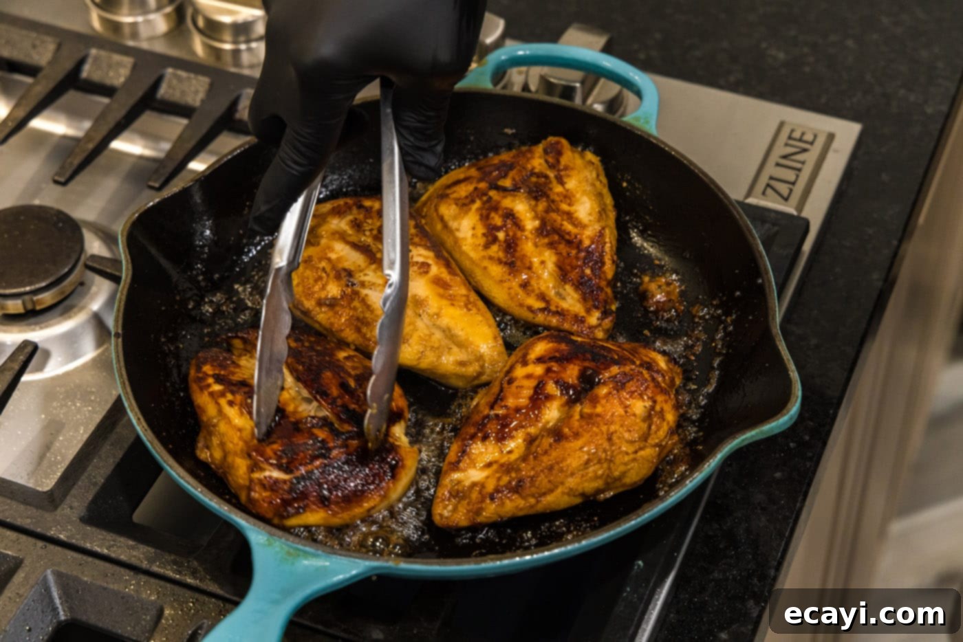 Sticky Honey Garlic Chicken 8 searing chicken breasts in a skillet