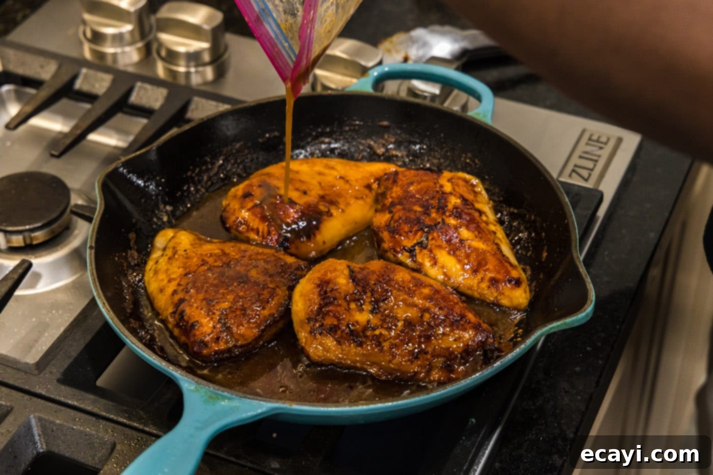 Sticky Honey Garlic Chicken 9 pouring marinade into skillet with chicken breasts