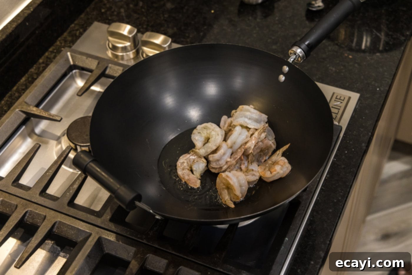 Teriyaki Shrimp 6 shrimp in a skillet with oil