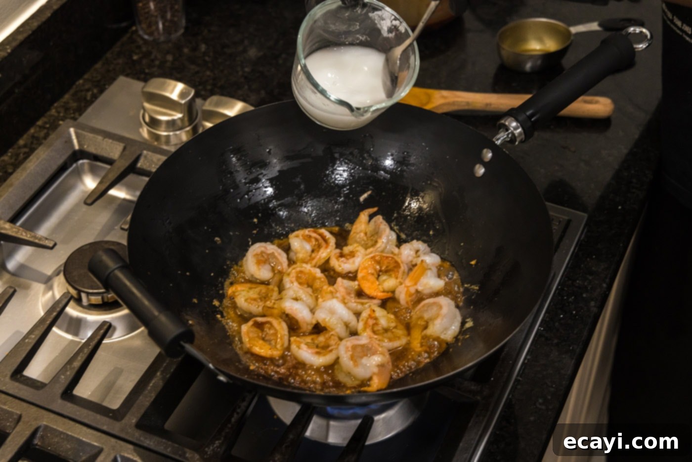 Teriyaki Shrimp 9 pouring a cornstarch slurry into teriyaki shrimp