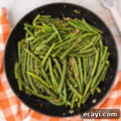 Garlic-Kissed Green Beans 11 Skillet of perfectly cooked Garlic Green Beans, ready to be served