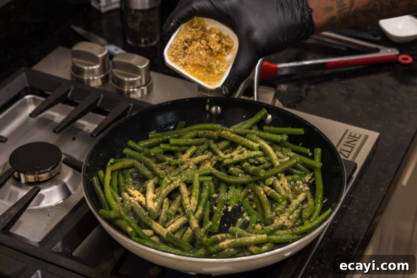 Garlic-Kissed Green Beans 8 adding remaining minced garlic to the skillet with herbs and green beans