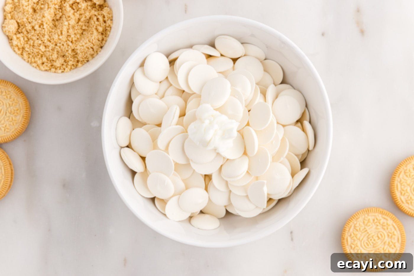 No-Bake Golden Oreo Bliss 13 White chocolate melting wafers in a microwave-safe bowl.