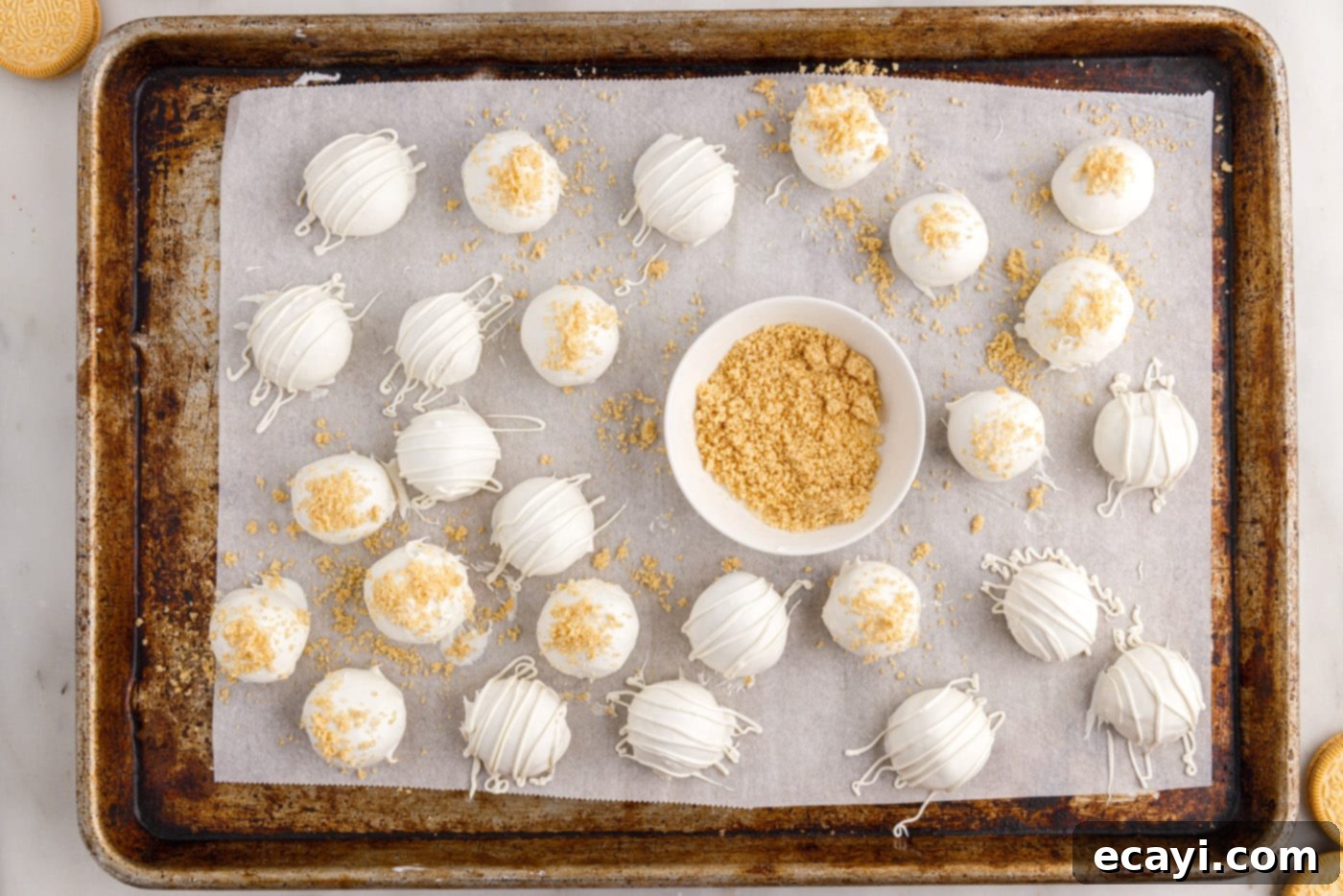 No-Bake Golden Oreo Bliss 16 Sprinkling reserved Golden Oreo cookie crumbs onto newly dipped truffles.