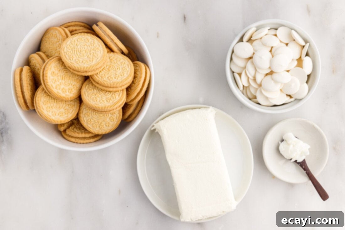 No-Bake Golden Oreo Bliss 4 All the essential ingredients for Golden Oreo Truffles laid out on a surface.