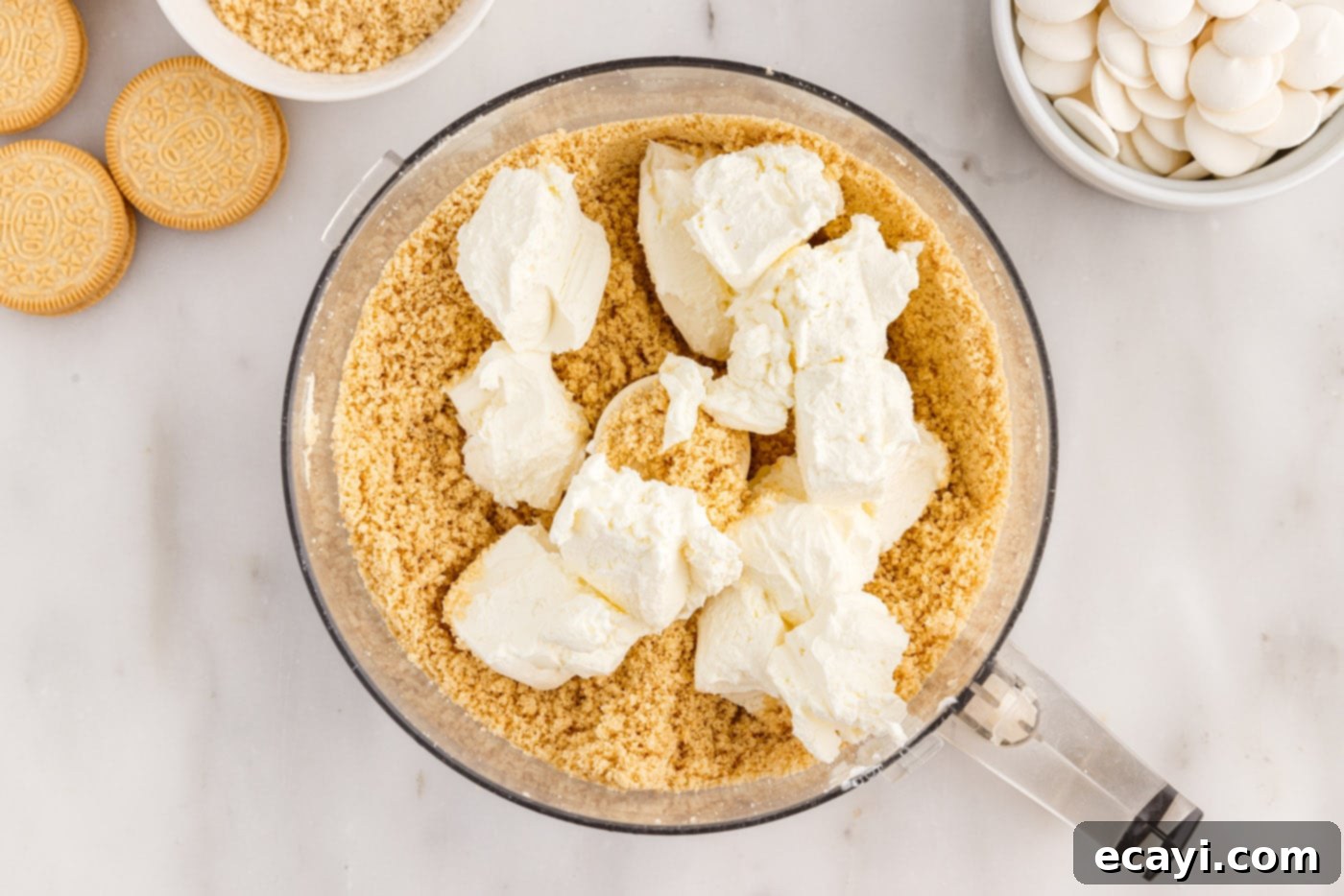 No-Bake Golden Oreo Bliss 8 Softened cream cheese added to the Golden Oreo crumbs in the food processor.