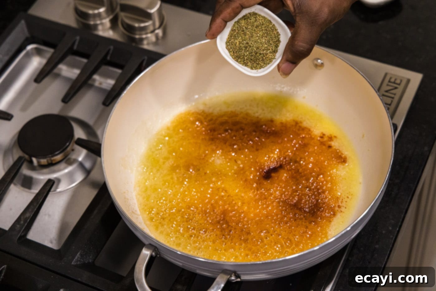 Shrimp Alfredo Bliss 8 Adding fragrant seasonings like paprika and Italian herbs to melted butter in a skillet