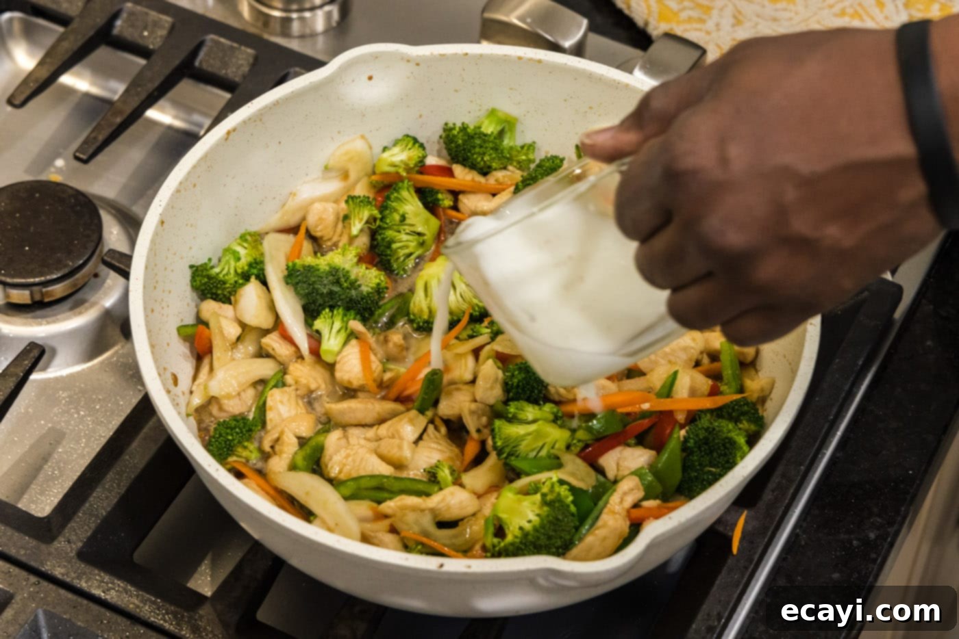 Sticky Honey Garlic Chicken Stir-Fry 12 adding a cornstarch slurry to skillet of honey garlic chicken stir fry