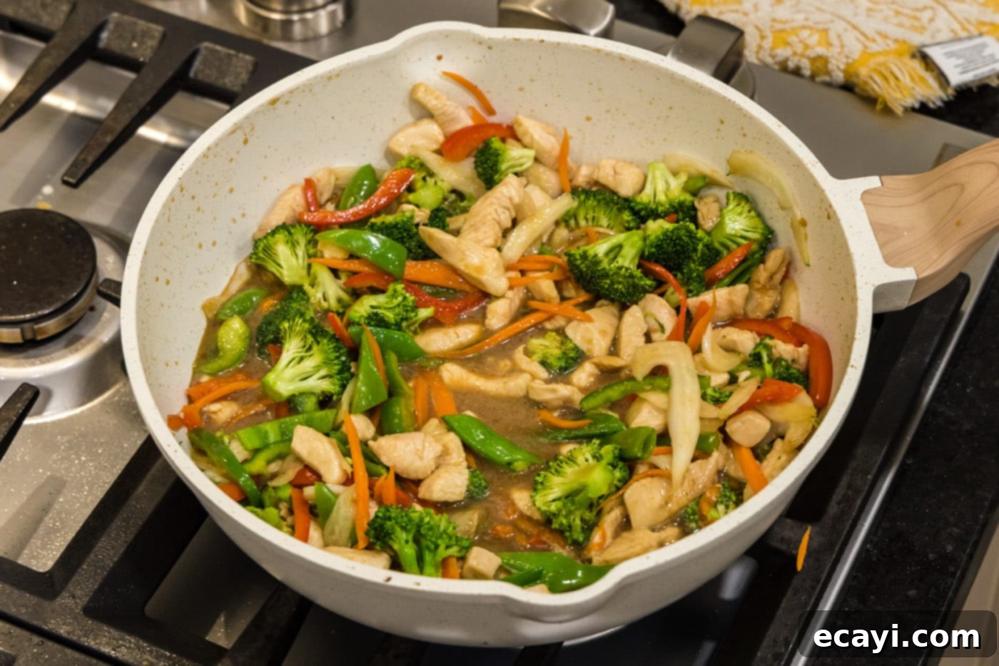 Sticky Honey Garlic Chicken Stir-Fry 13 stir fried honey garlic chicken in a skillet