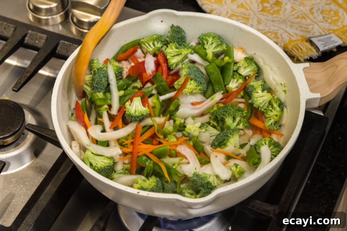 Sticky Honey Garlic Chicken Stir-Fry 10 stir fry vegetables in a skillet