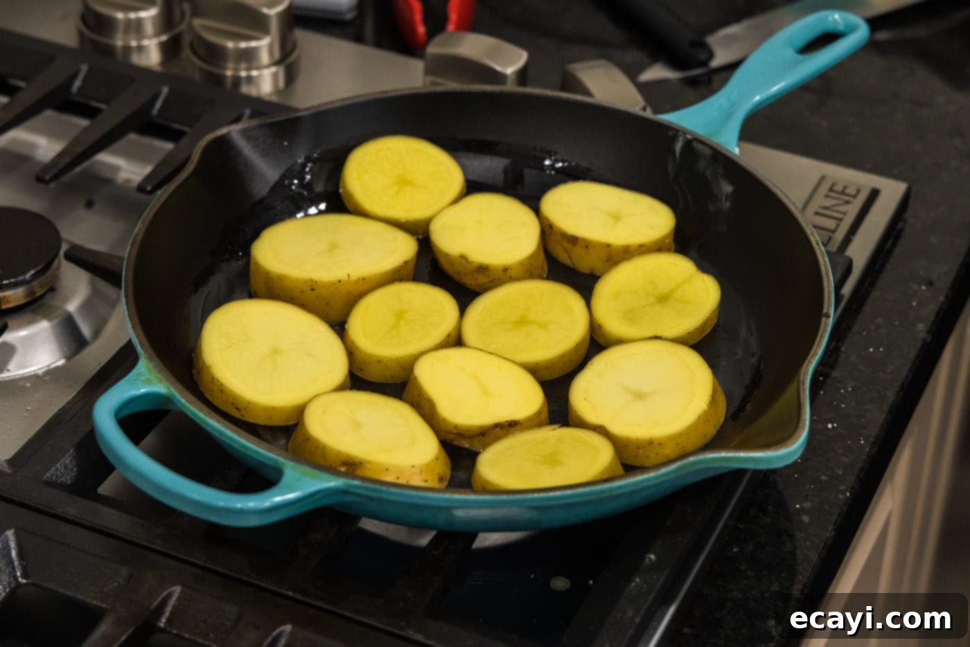 Ultra-Tender Melting Potatoes 5 potato rounds in a skillet