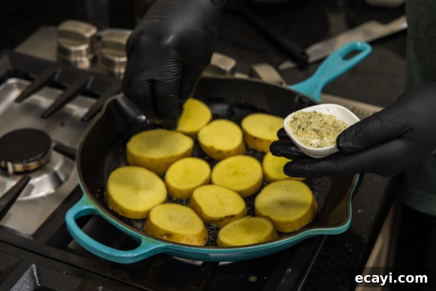 Ultra-Tender Melting Potatoes 6 seasoning potato rounds in a skillet