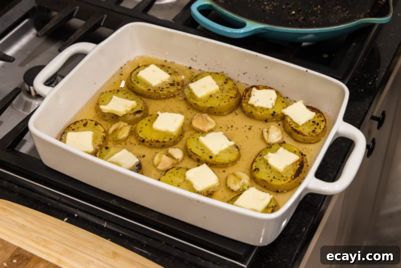 Ultra-Tender Melting Potatoes 9 pats of butter on top of potato slices cooked in chicken broth