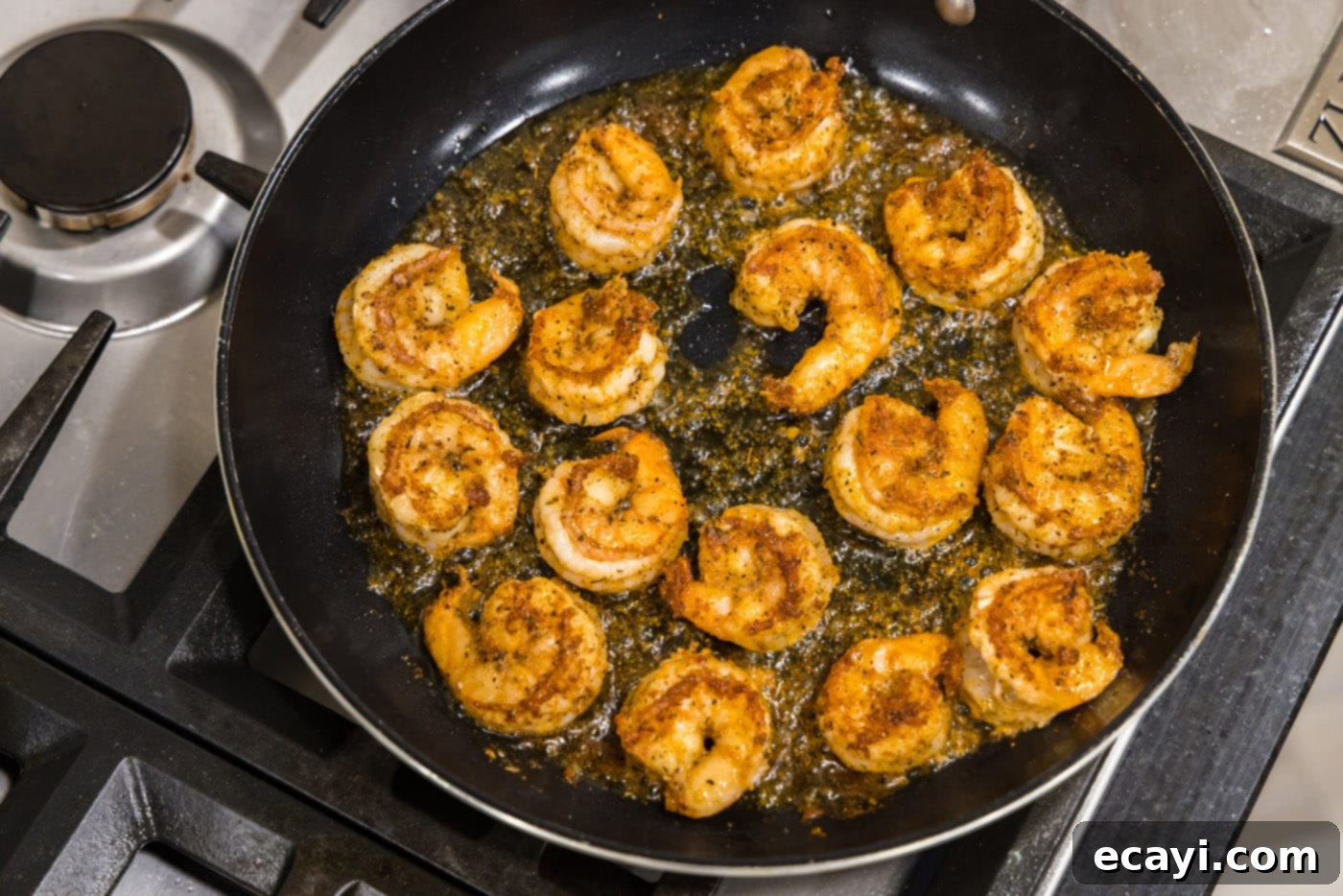 Fiery Cajun Prawns 7 cooked cajun shrimp in a skillet