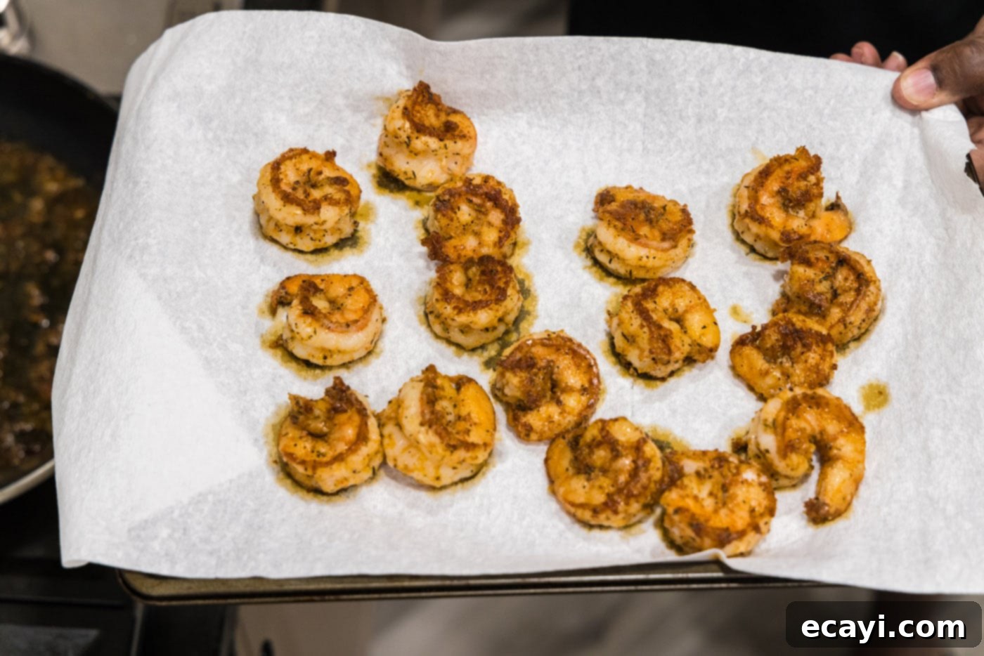 Fiery Cajun Prawns 9 seasoned cooked shrimp on a paper towel