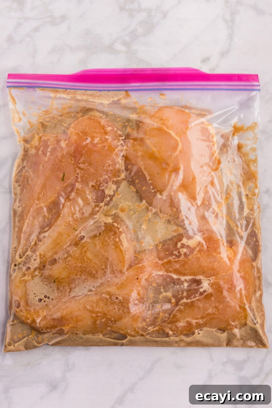 Delicious Honey Garlic Chicken Marinade 3 Honey Garlic Chicken Marinade in a zip top bag with chicken breasts, ready for marination