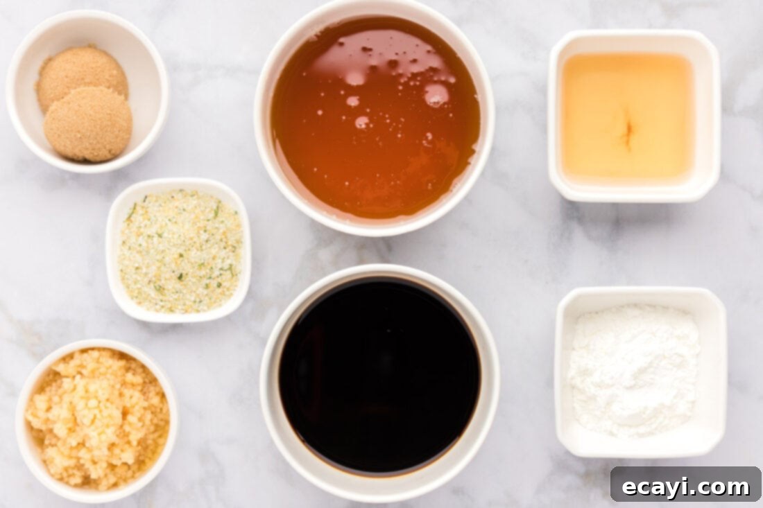 Delicious Honey Garlic Chicken Marinade 4 A flat lay photograph displaying all the fresh ingredients needed for Honey Garlic Chicken Marinade, including soy sauce, honey, minced garlic, brown sugar, and white wine vinegar.