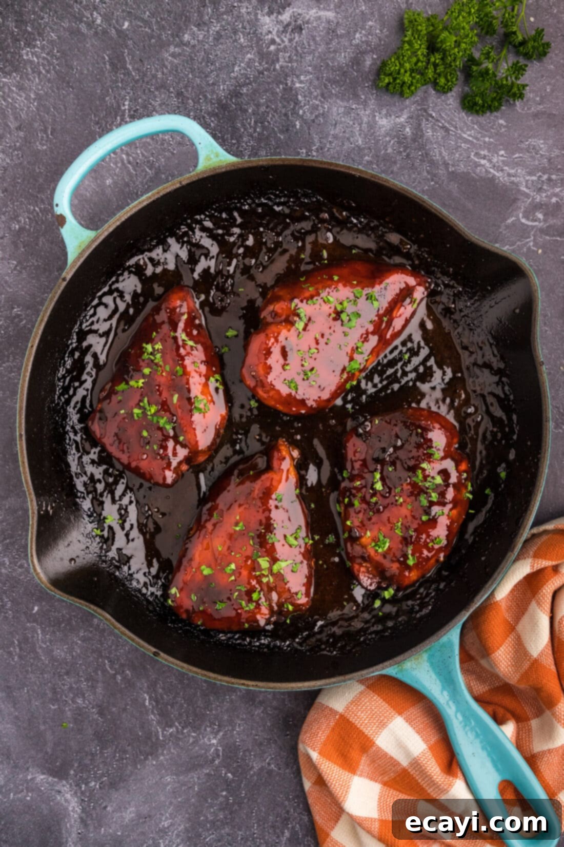 Delicious Honey Garlic Chicken Marinade 8 Honey Garlic Chicken Breasts cooked in a skillet, glazed with the homemade sauce and garnished.