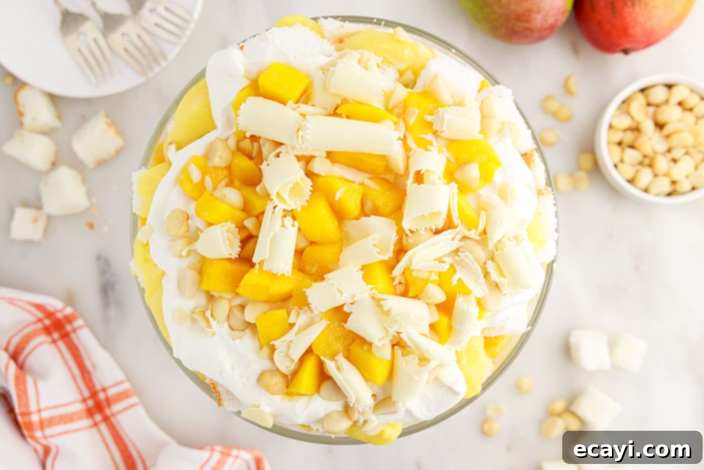 Golden Mango Indulgence 13 Delicate white chocolate shavings gracefully scattered over the top layer of a finished Mango Trifle.