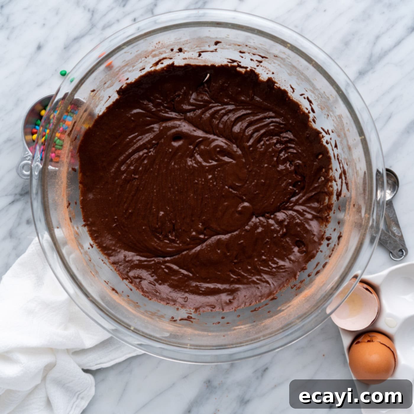 Dark Matter Delights 13 Fudgy brownie batter in a mixing bowl, perfectly combined and ready for the baking pan.