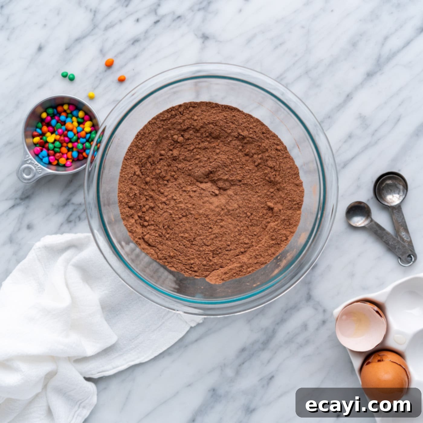 Dark Matter Delights 6 Flour and cocoa powder mixture in a bowl, showing the sifted and combined texture, ready for wet ingredients.