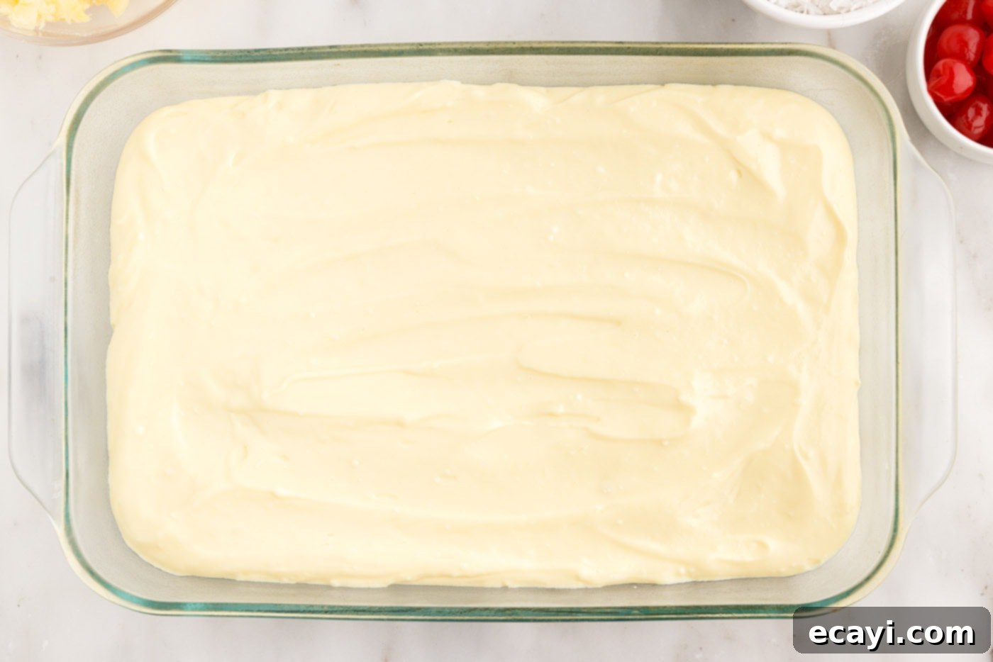 Billionaire Bliss Cake 11 A smooth, even layer of cream cheese pudding spread over the cooled cake base.
